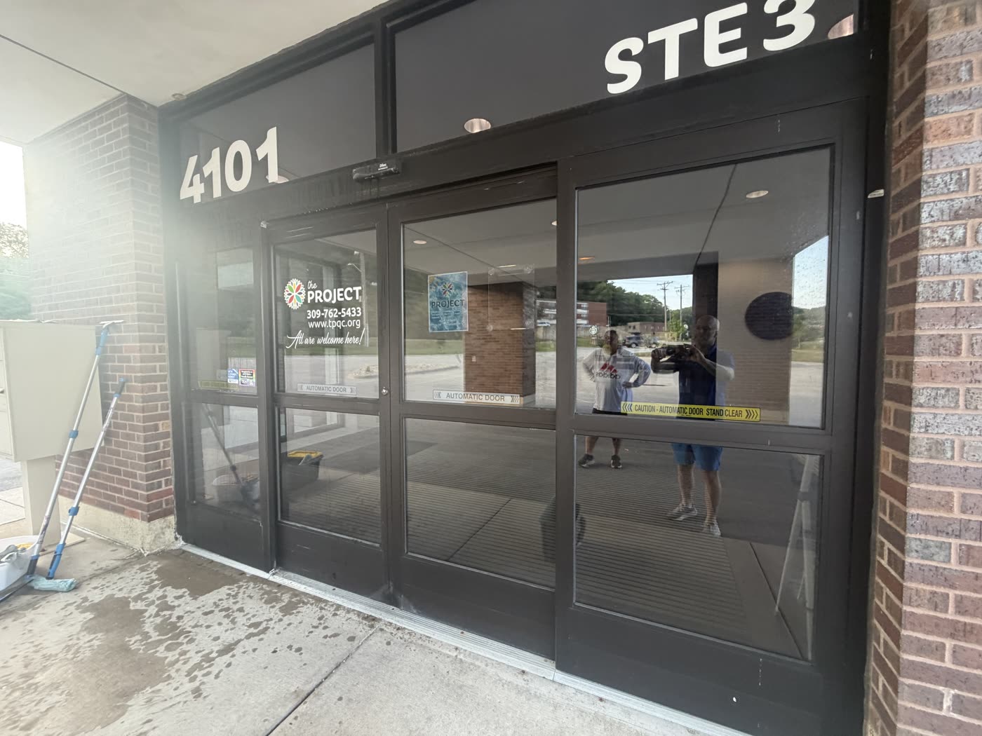 The Project storefront entrance glass