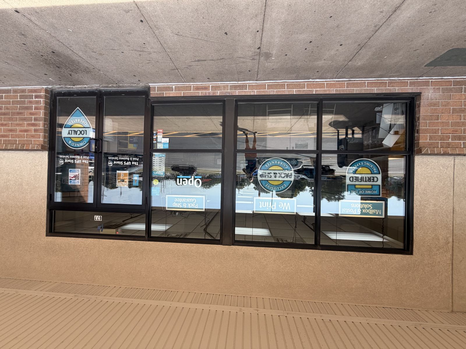 Commercial window cleaning storefront, Quad Cities, Iowa